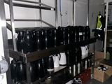 many cups and mugs on the shelves in the room