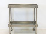 an image of a stainless steel serving cart on wheels