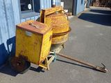 a yellow machine that is sitting outside of a building