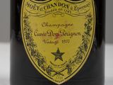 a bottle of champagne on a table with a star on the label