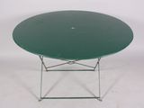a green table with a metal base on a white background
