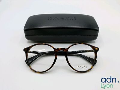 a close up of a pair of glasses on a table