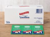 une boîte de thé à la vanille et deux sachets de thé à la vanille posés sur une table