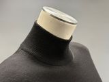 the neck of a black sweater with a white stripe on it