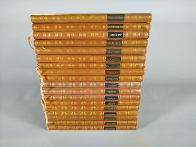 several books stacked on top of each other on a white surface