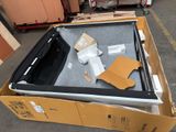 a box with a laptop computer in it sitting on the floor