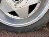 a close up of a tire with a nut on it