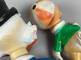 three toy figurines of a man and a woman