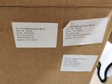 a cardboard box with a pair of scissors in it