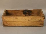 a small wooden box with a handle on a table