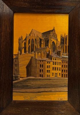 une peinture à l'huile représentant une cathédrale, dans un cadre en bois