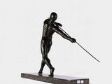 statue of a man holding a spear on a marble base