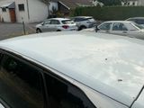 many cars parked in a parking lot next to each other