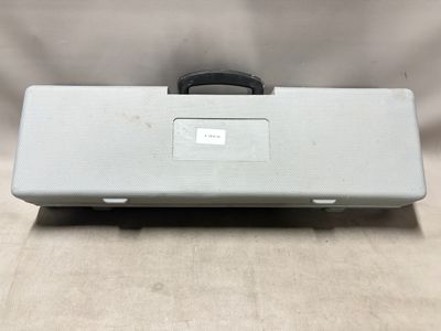 a close up of a silver case with a black handle
