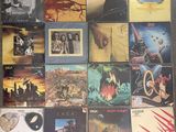 a lot of different album covers on the floor