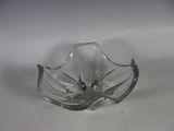 a glass bowl that has a leaf design on it