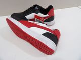 pair of black and red puma sneakers on a white surface