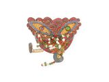 a small decorative object that is hanging on the wall