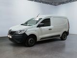 the white van is parked in a large room with white walls