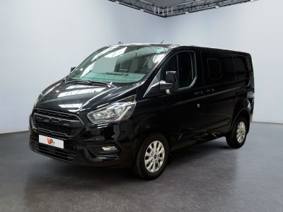 the black van is parked in a large room with white walls