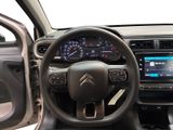the interior of a car with a steering wheel and dashboard controls