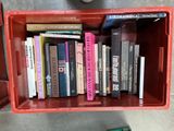 a red box with a bunch of books on top of it