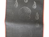 a close up of a piece of fabric with a drawing on it
