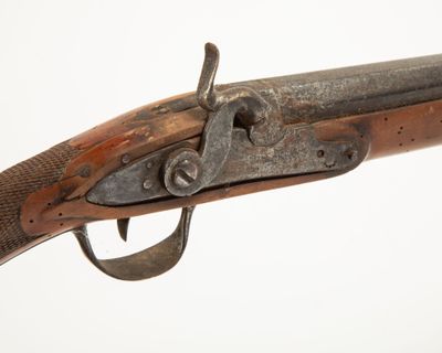 a close up of a rifle on a white background with a white background