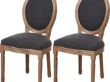 deux chaises en bois avec des assises rembourrées noires