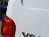 a white van with a vw logo on the back of it