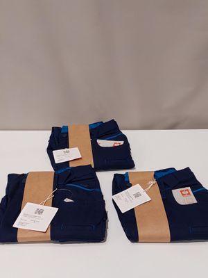 three pairs of men ' s blue pants with tags on them