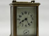 a small clock that is sitting on a table