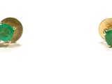 pair of emerald earrings on a white background