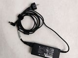 a laptop charger with a cord attached to it