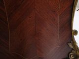 a large wooden clock on display in a room