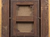 an old picture of a wooden frame with a picture in it