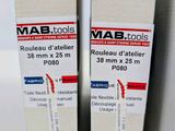 two boxes of mab tools are stacked on top of each other