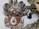 many masks that are sitting on a table