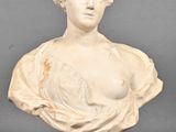 marble bust of a woman with a bust on top of a pedestal