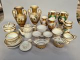 many different types of vases and bowls on the table