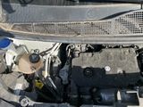 a picture of a car engine with its hood open