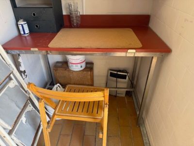 a small table and chair in a small room