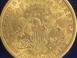 a close up of a gold coin on a blue cloth