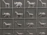 a lot of different animals that are on a display