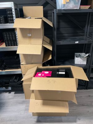 several cardboard boxes stacked on top of each other in a room