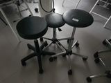 three stools sitting on top of each other in a room