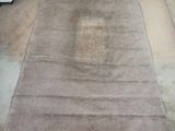 rug on the floor is dirty and needs to be cleaned