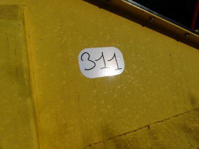 a small number on the side of a yellow truck
