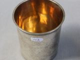 an image of a silver cup sitting on top of a table