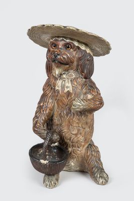 figurine représentant un chien coiffé d'un sombrero et tenant un bol